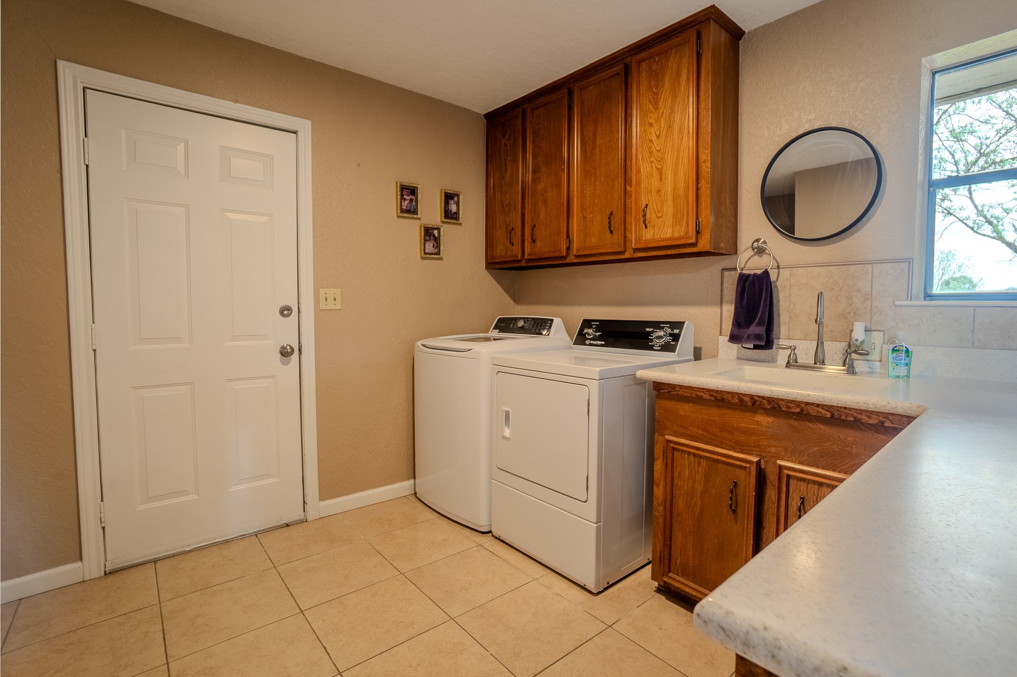 2745 Holub Road Schulenburg, TX 78956 - Photo 39 of 40 a room with a sink a washer and dryer