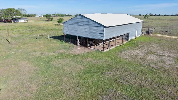 an aerial view of a house with pool lake view and mountain view