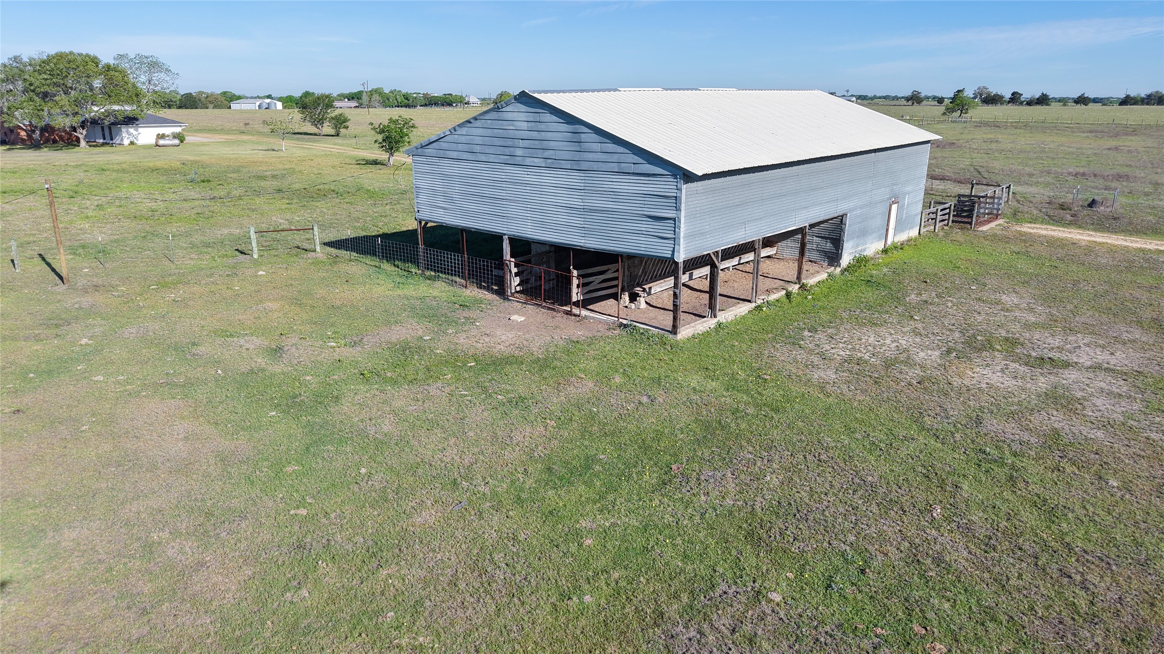 2745 Holub Road Schulenburg, TX 78956 - Photo 8 of 40 an aerial view of a house with pool lake view and mountain view