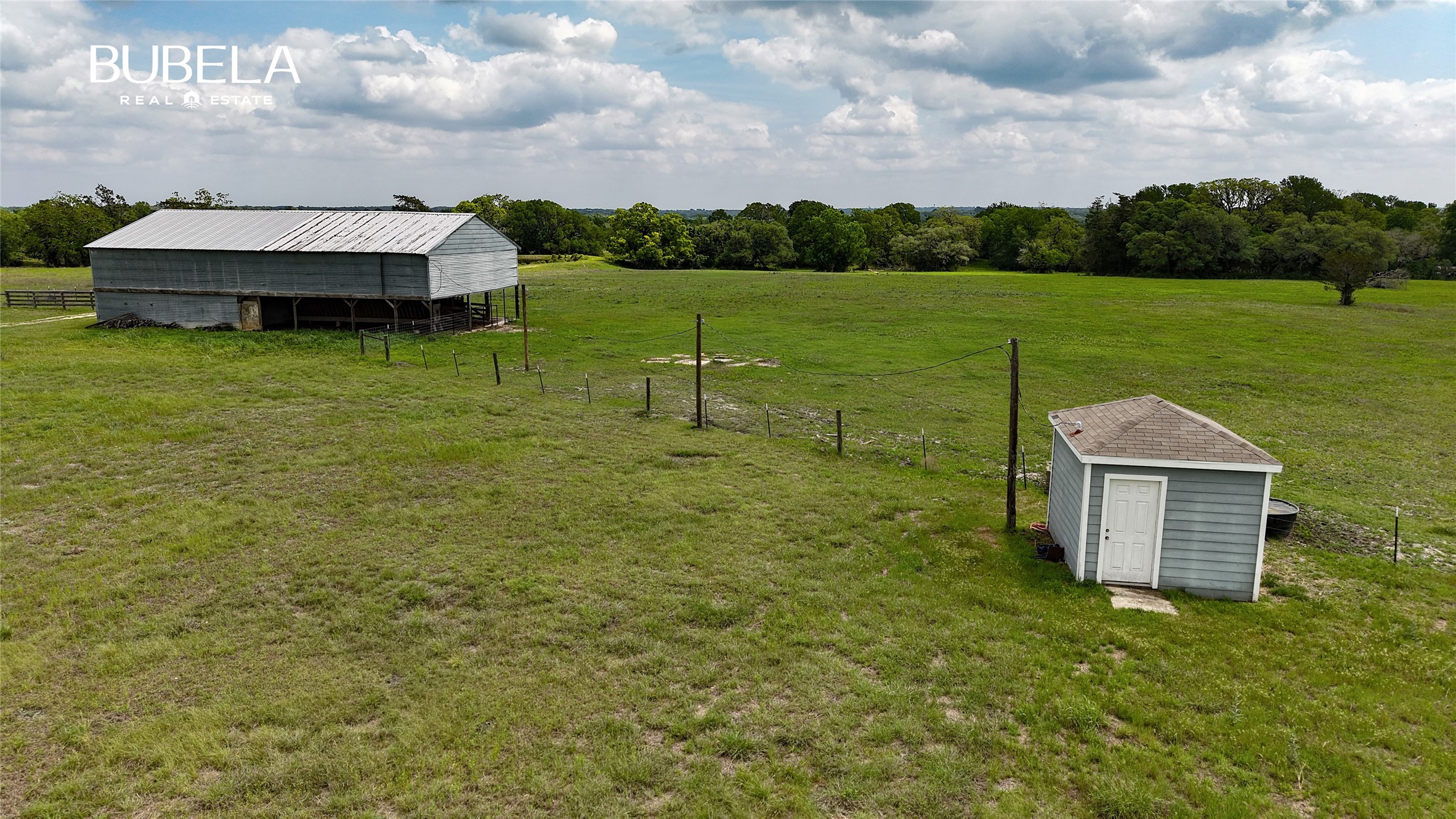 2745 Holub Road Schulenburg, TX 78956 - Photo 9 of 40 a view of a garden with a large trees