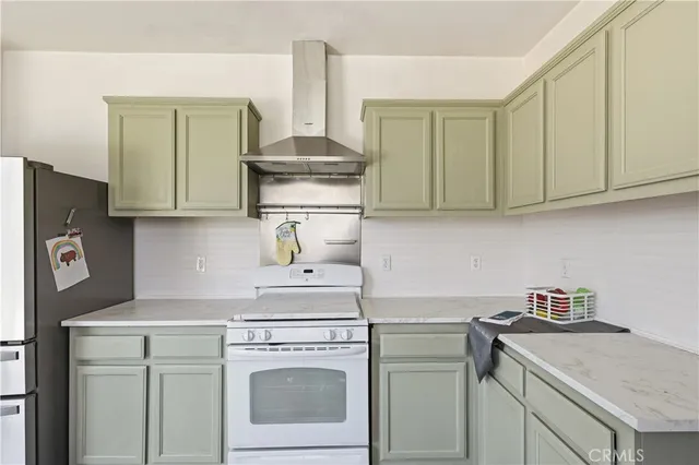 a kitchen with a stove oven and cabinets