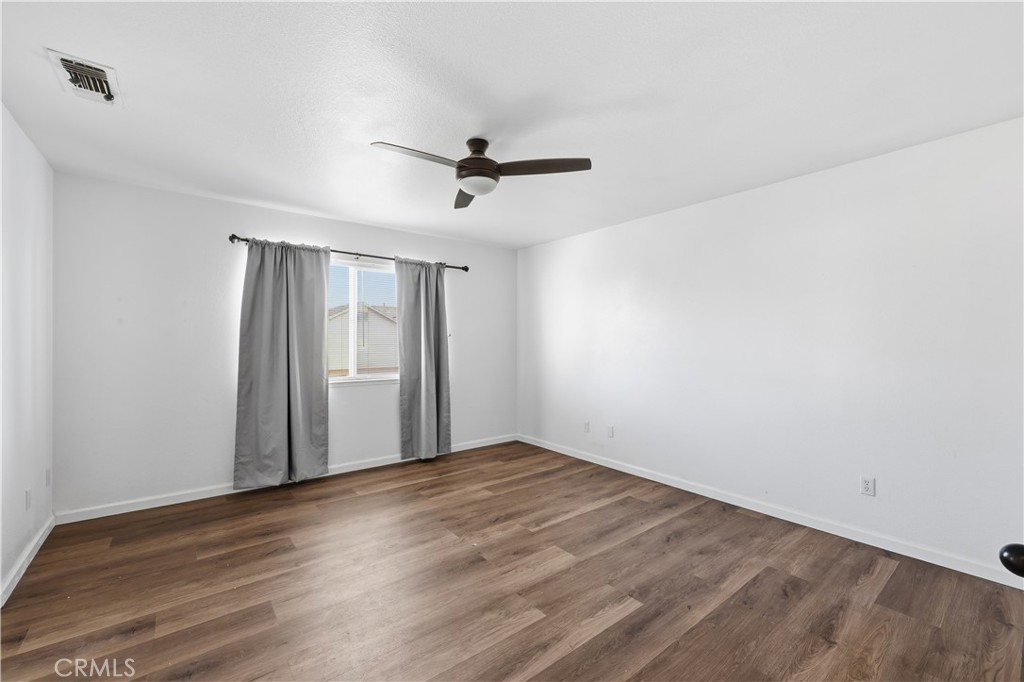 84 Jack Court Merced, CA 95341 - Photo 17 of 34 wooden floor in an empty room