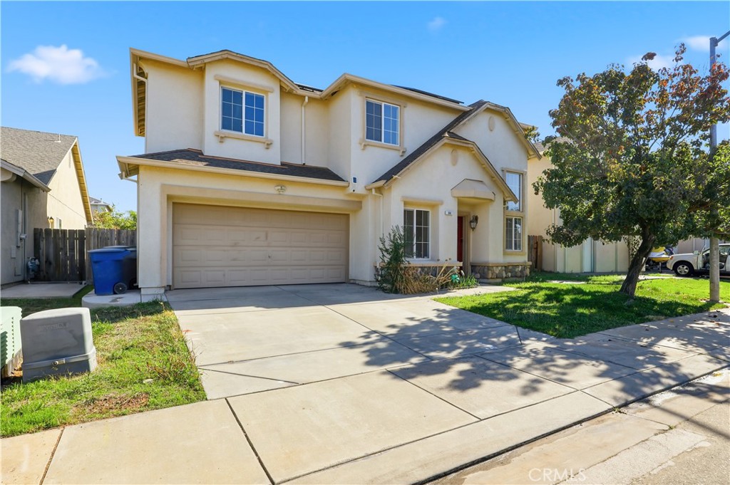 84 Jack Court Merced, CA 95341 - Photo 2 of 34 a front view of a house with garden