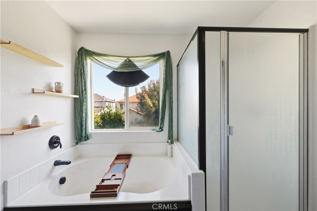 84 Jack Court Merced, CA 95341 - Photo 21 of 34 a bathroom with a tub and shower