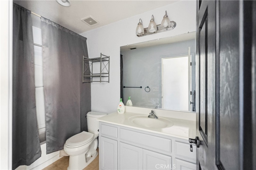 84 Jack Court Merced, CA 95341 - Photo 26 of 34 a bathroom with a sink toilet and shower