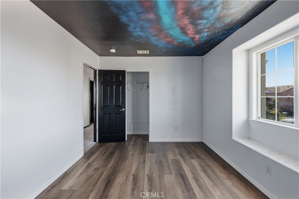 84 Jack Court Merced, CA 95341 - Photo 28 of 34 a view of hallway with wooden floor and entryway