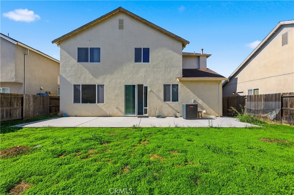84 Jack Court Merced, CA 95341 - Photo 32 of 34 a front view of house with yard and and car parked