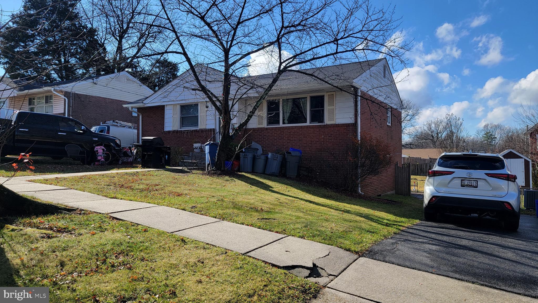 11406 Sherrie Lane Silver Spring, MD 20902 - Photo 1 of 1 a front view of a house with a yard