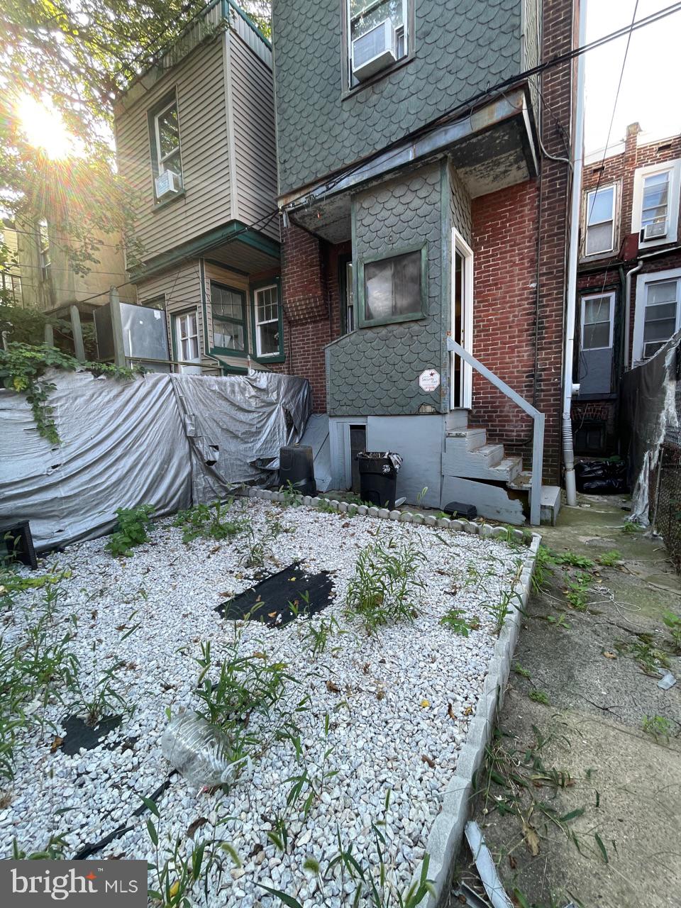 1115 West Wyoming Avenue Philadelphia, PA 19140 - Photo 15 of 33 a front view of a house with garden