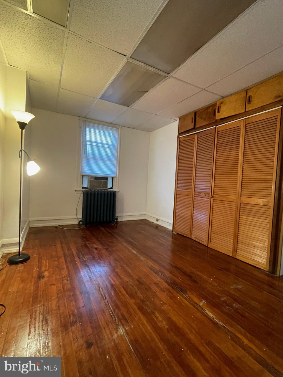 1115 West Wyoming Avenue Philadelphia, PA 19140 - Photo 20 of 33 a view of empty room with wooden floor