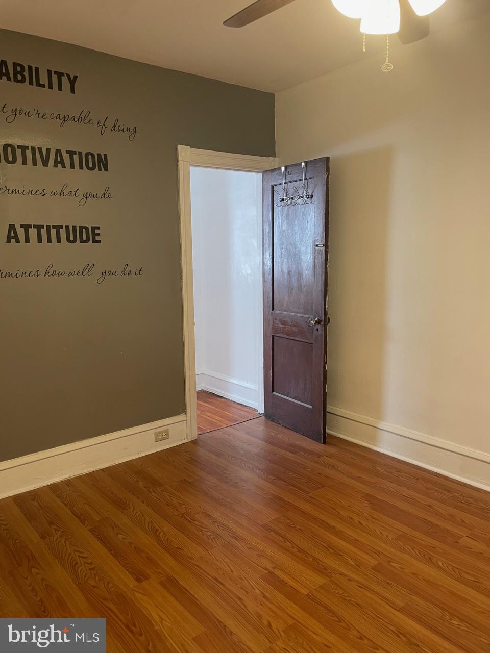 1115 West Wyoming Avenue Philadelphia, PA 19140 - Photo 25 of 33 an empty room with wooden floor and windows