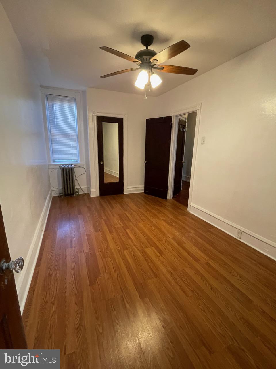 1115 West Wyoming Avenue Philadelphia, PA 19140 - Photo 27 of 33 wooden floor in an empty room with a window