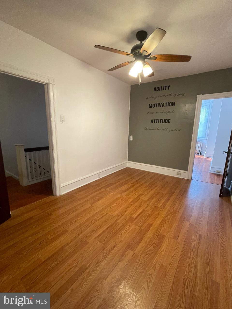 1115 West Wyoming Avenue Philadelphia, PA 19140 - Photo 28 of 33 a view of an empty room with a window and wooden floor