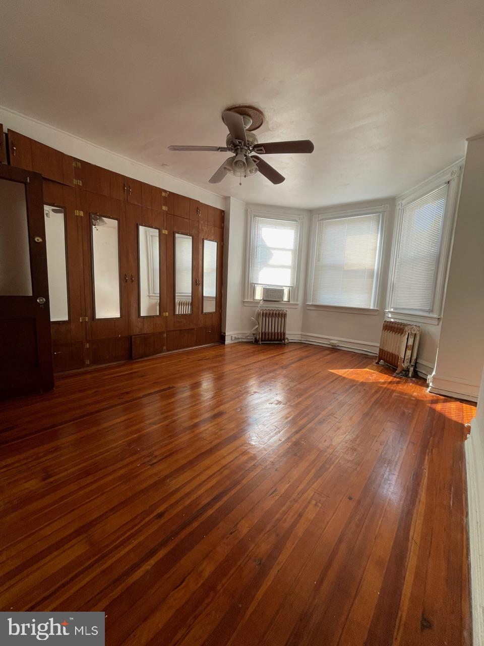 1115 West Wyoming Avenue Philadelphia, PA 19140 - Photo 30 of 33 a view of a room with wooden floor and window