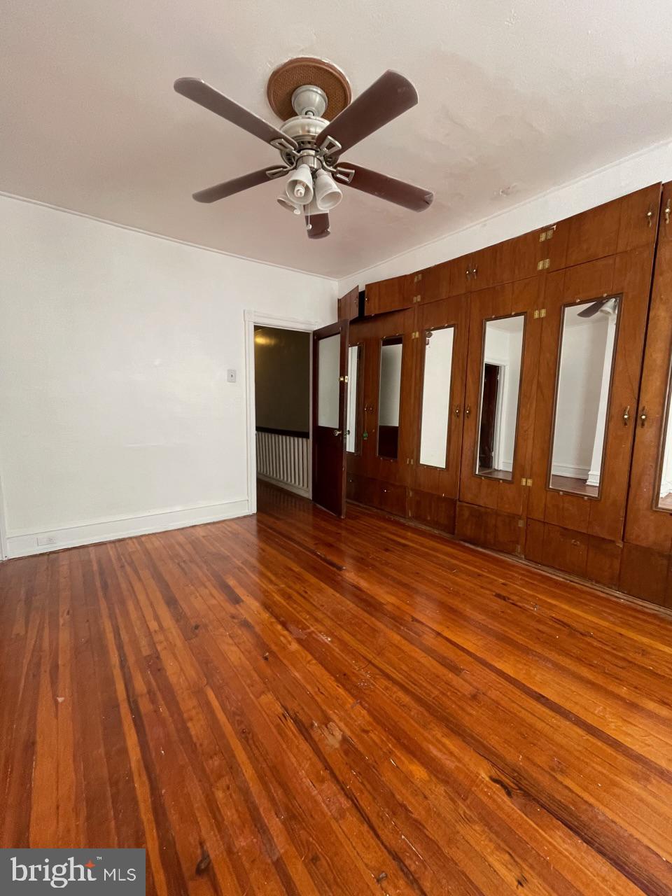 1115 West Wyoming Avenue Philadelphia, PA 19140 - Photo 31 of 33 a view of wooden floor and a chandelier fan