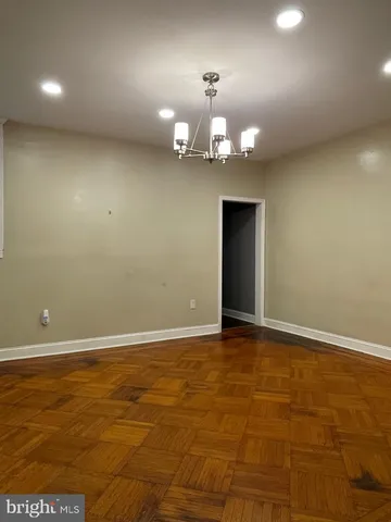 a kitchen with stainless steel appliances granite countertop a refrigerator a sink and a stove