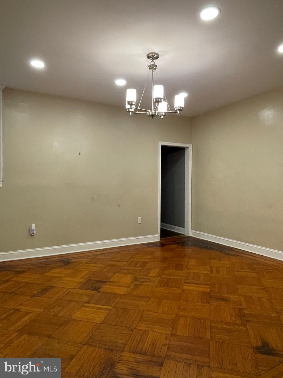 1115 West Wyoming Avenue Philadelphia, PA 19140 - Photo 8 of 33 a view of an empty room with a chandelier fan