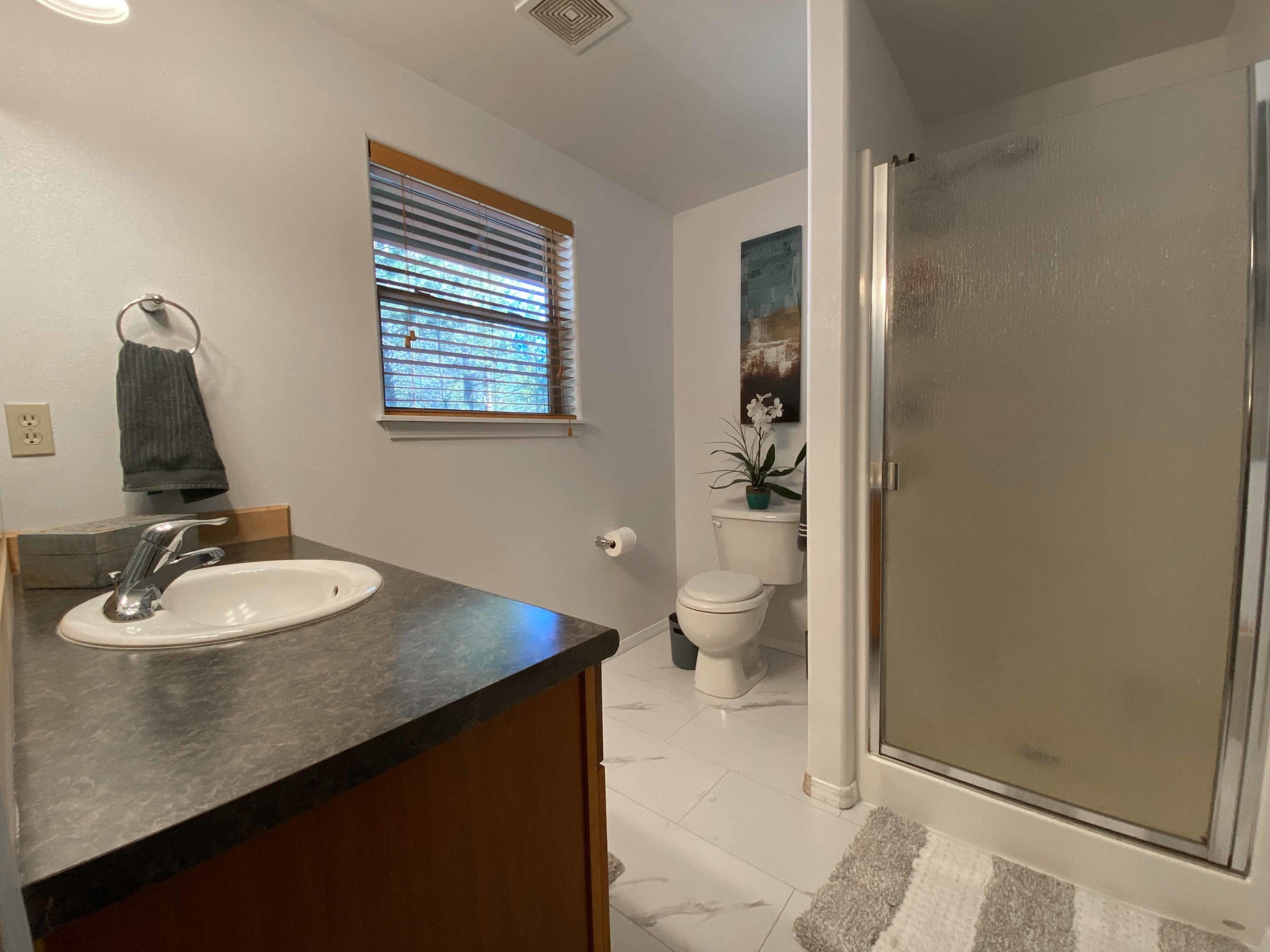 15900 Old Mill Road La Pine, OR 97739 - Photo 13 of 18 Primary bathroom with new tile flooring