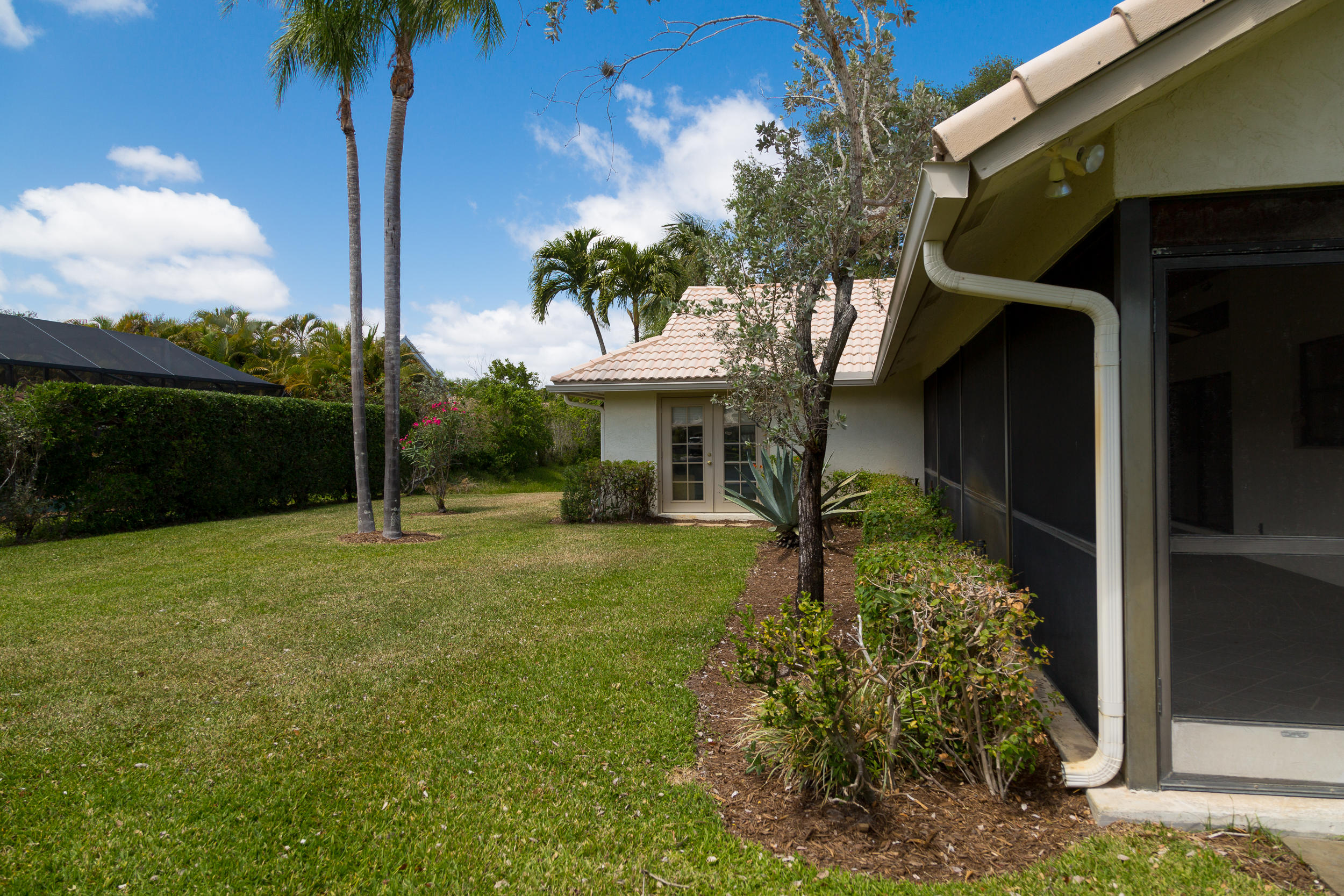 2330 Rabbit Hollowe Circle Delray Beach, FL 33445 - Photo 9 of 39 Side yard right off the Lanai!
