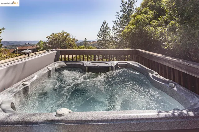 a view of a balcony with trees