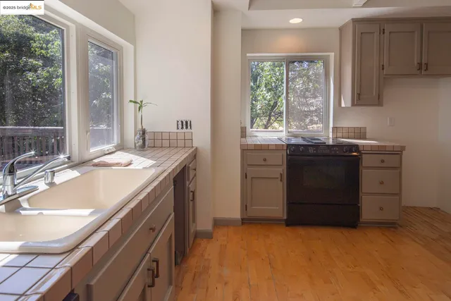 a kitchen with a stove and cabinets