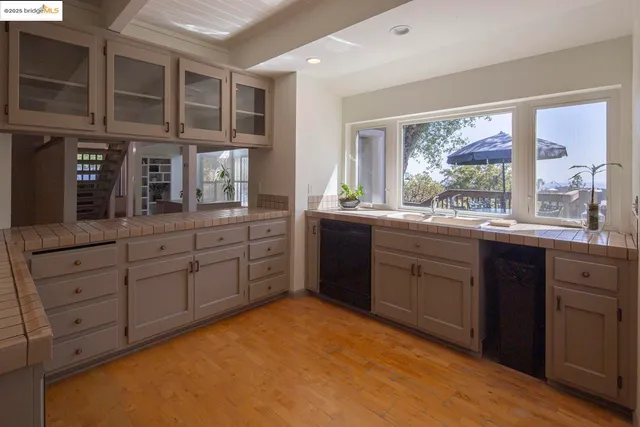 a kitchen with stainless steel appliances granite countertop a stove and a refrigerator