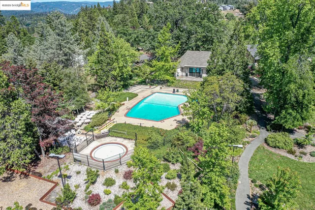 a view of a house with a yard and garden