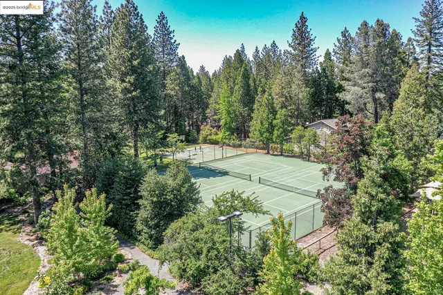an outdoor space with furniture and garden