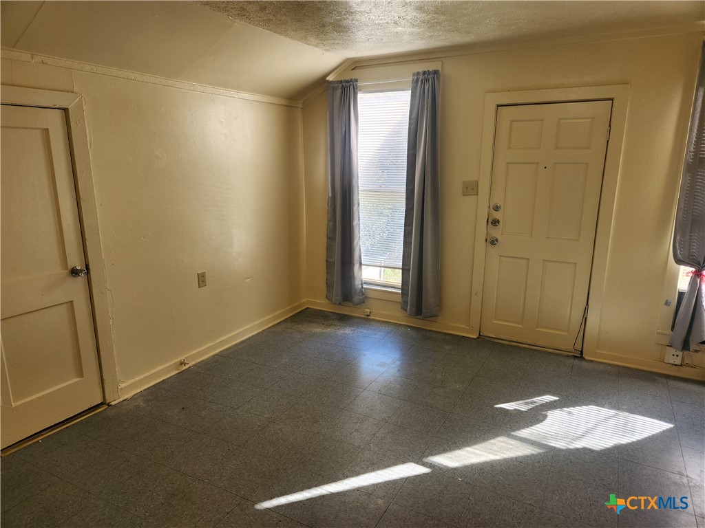 1205 South 17th Street Temple, TX 76504 - Photo 4 of 7 an empty room with windows