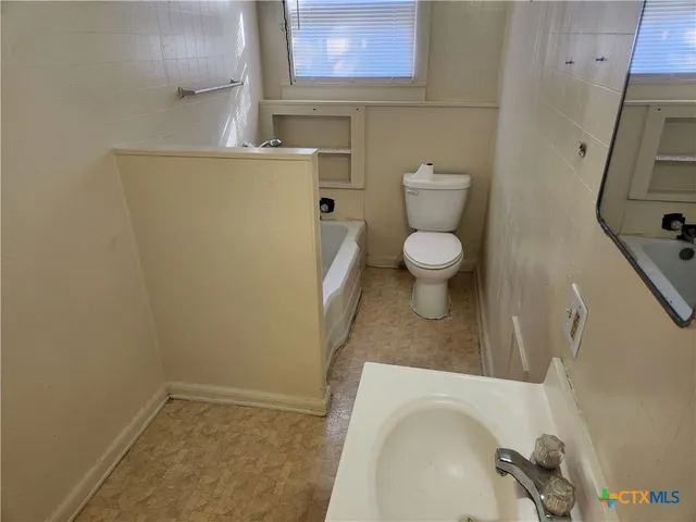 a bathroom with a sink and a toilet