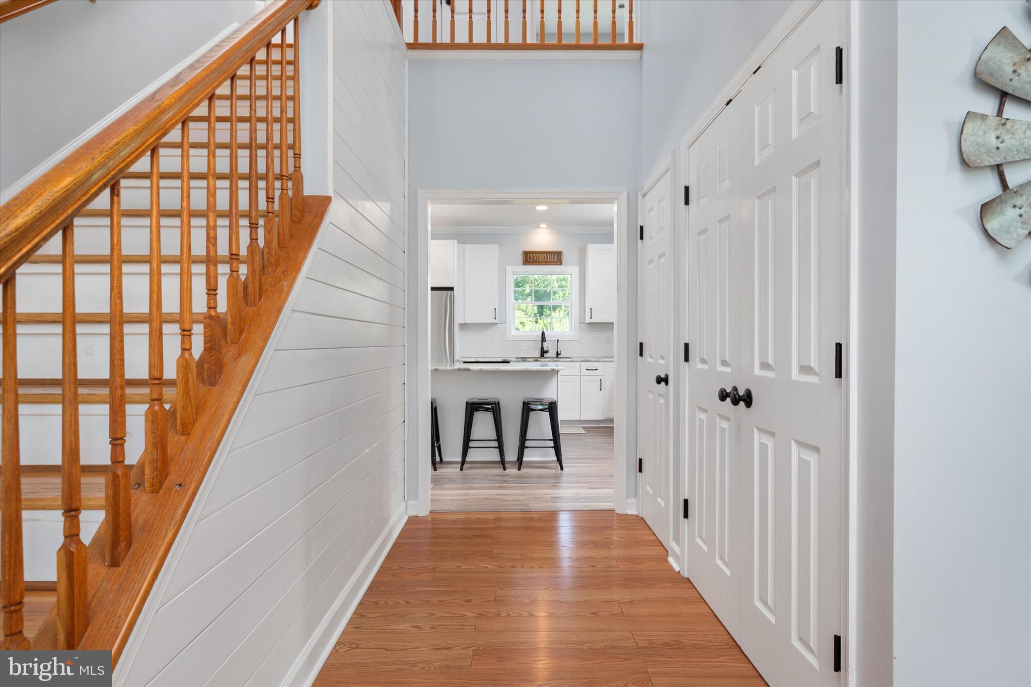 913 Clark Corner Road Centreville, MD 21617 - Photo 10 of 66 a view of a hallway with wooden floor and staircase