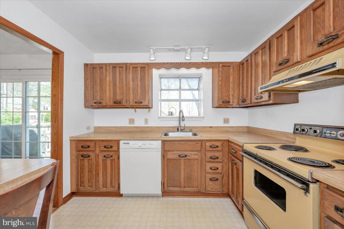 1300 Holliben Road Severna Park, MD 21146 - Photo 19 of 69 a kitchen with a stove sink and cabinets