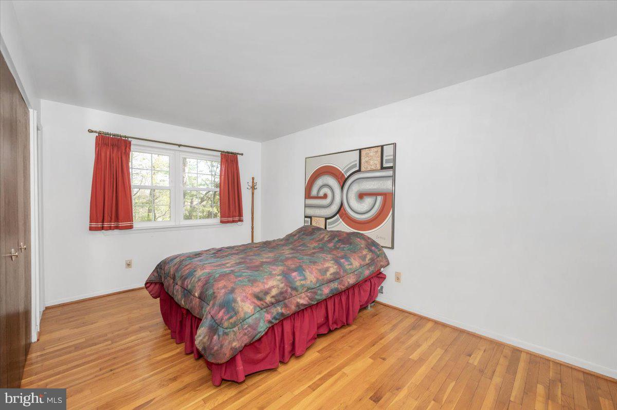 1300 Holliben Road Severna Park, MD 21146 - Photo 21 of 69 a bedroom with a bed and a window