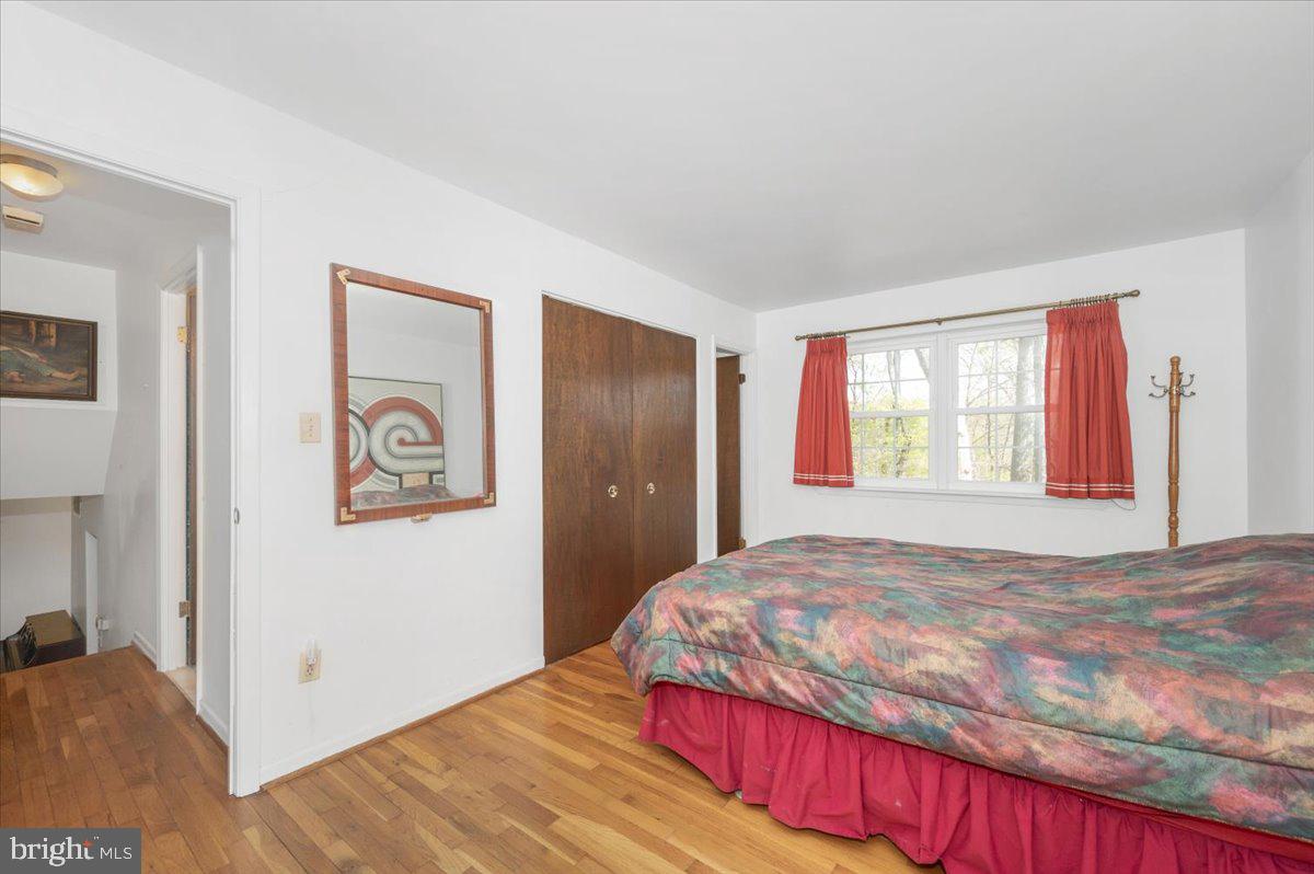 1300 Holliben Road Severna Park, MD 21146 - Photo 22 of 69 a bedroom with a bed and a window