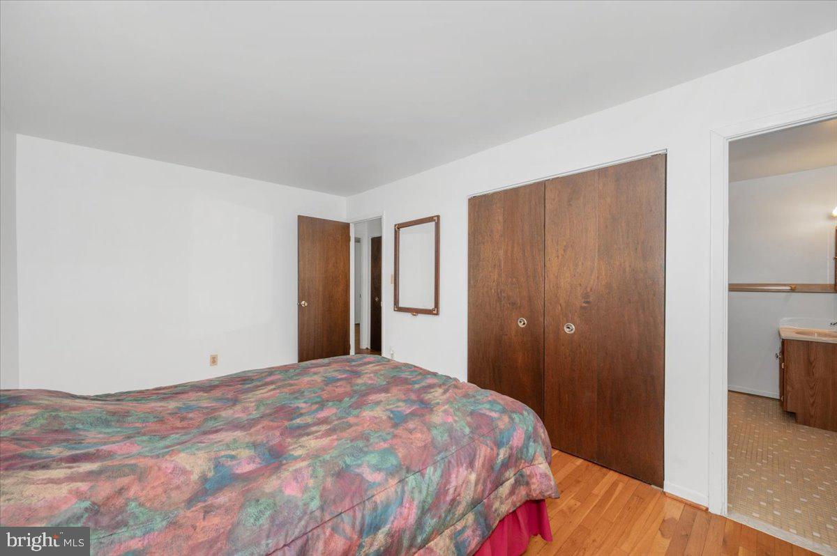1300 Holliben Road Severna Park, MD 21146 - Photo 23 of 69 a bedroom with a bed and a flat screen tv