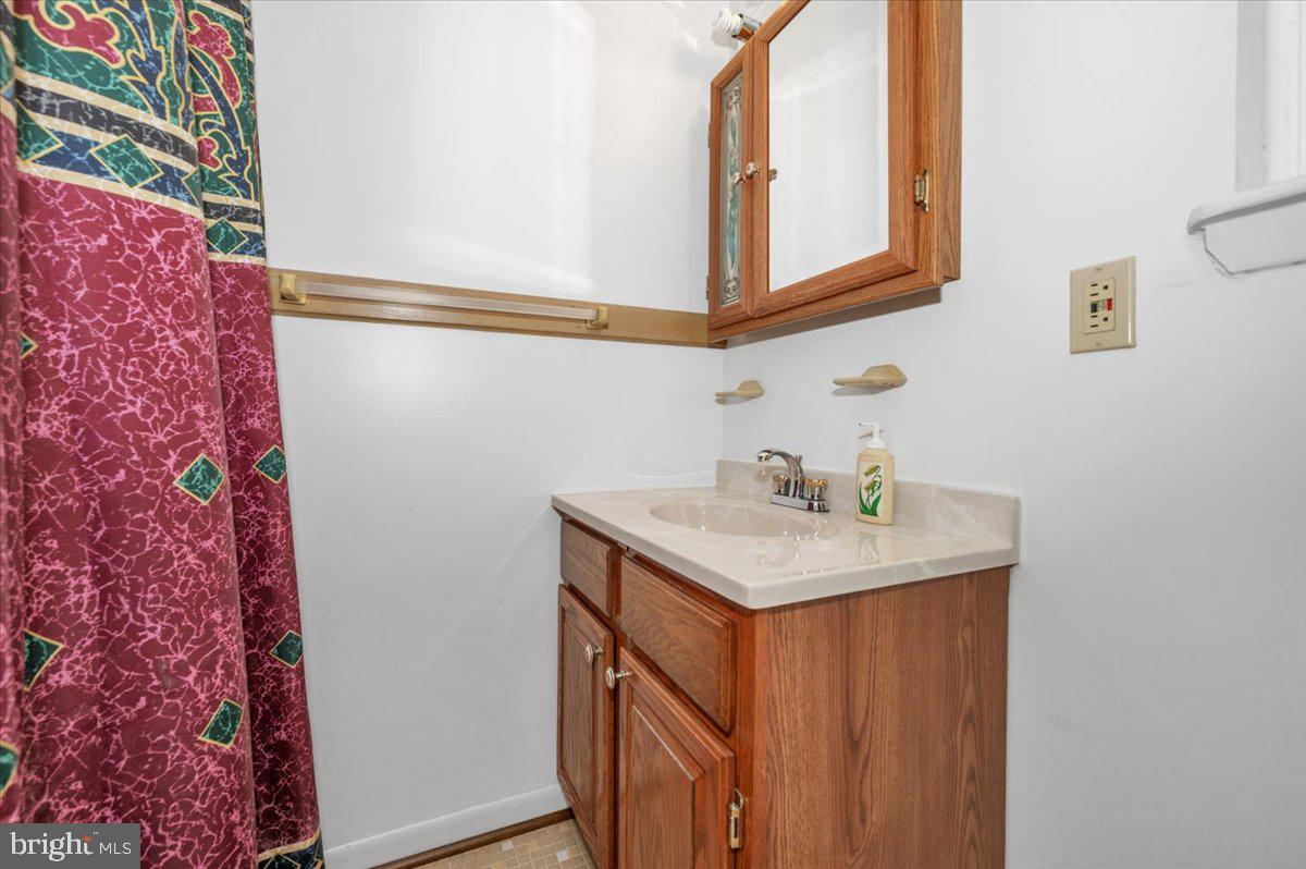 1300 Holliben Road Severna Park, MD 21146 - Photo 26 of 69 a bathroom with a sink and a mirror