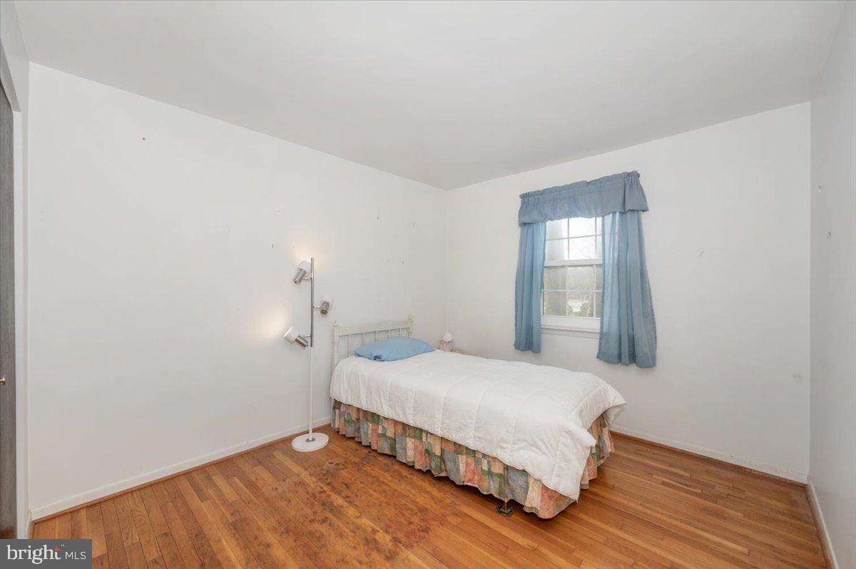 1300 Holliben Road Severna Park, MD 21146 - Photo 27 of 69 a bedroom with a bed and wooden floor