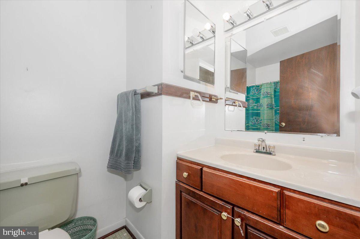 1300 Holliben Road Severna Park, MD 21146 - Photo 31 of 69 a bathroom with a sink and a mirror
