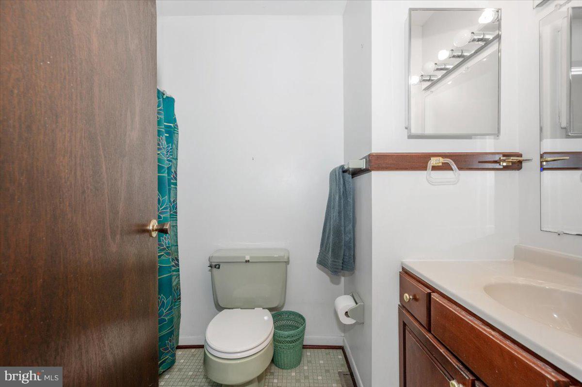 1300 Holliben Road Severna Park, MD 21146 - Photo 32 of 69 a white toilet sitting next to a bathroom sink