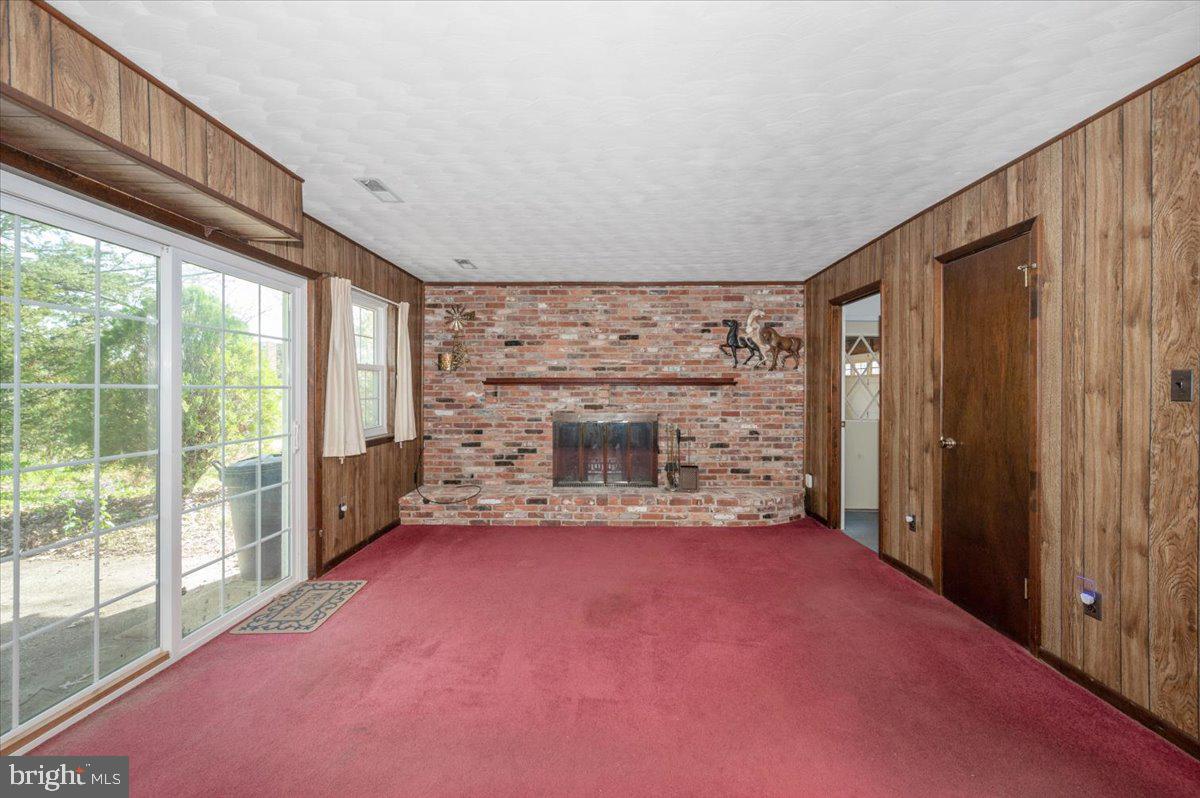 1300 Holliben Road Severna Park, MD 21146 - Photo 35 of 69 a view of an empty room with a fireplace and a window