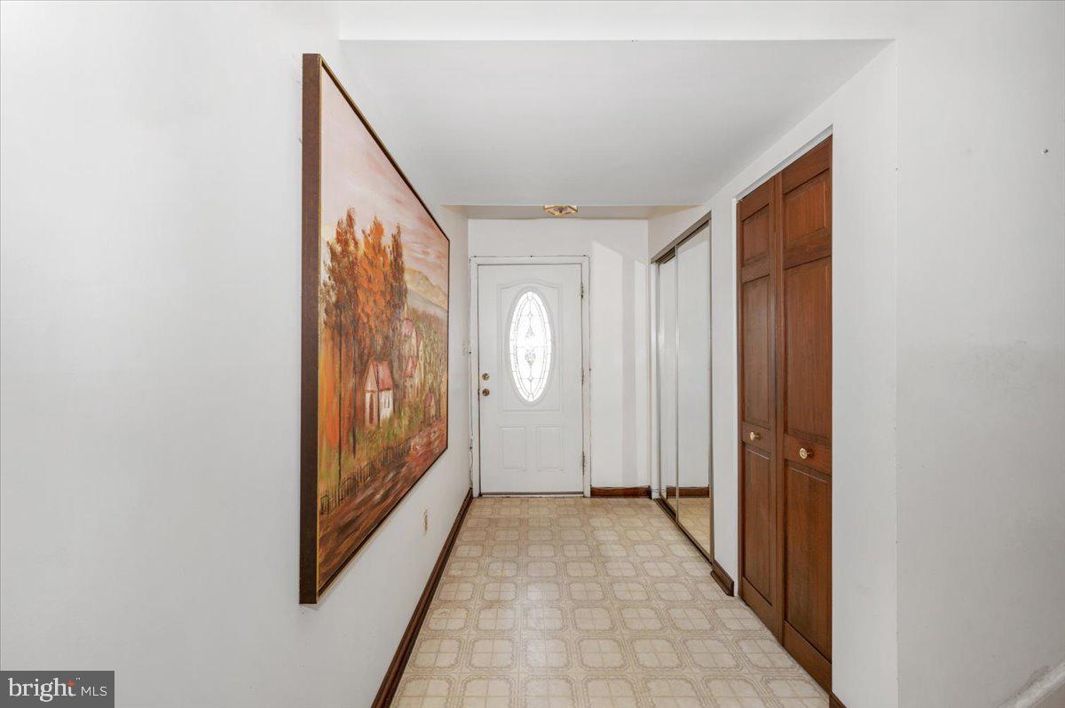 1300 Holliben Road Severna Park, MD 21146 - Photo 4 of 69 a view of a hallway with wooden floor and windows