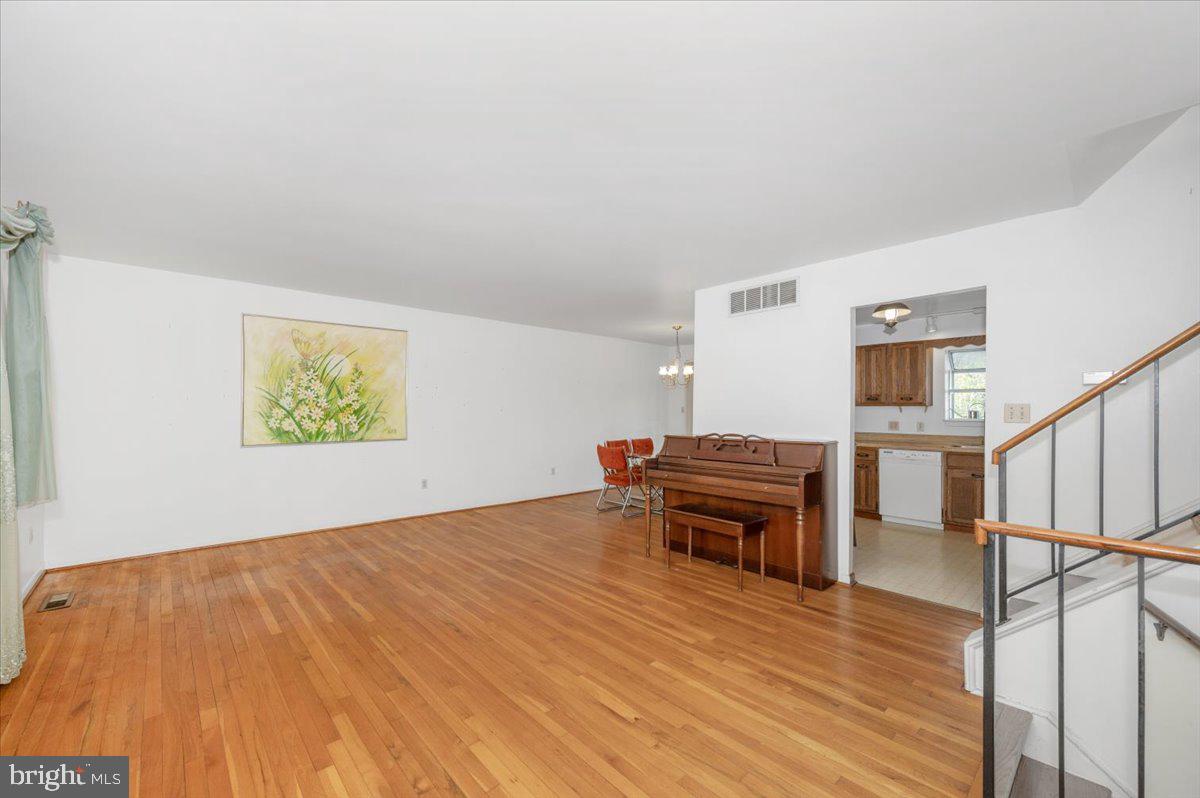 1300 Holliben Road Severna Park, MD 21146 - Photo 10 of 69 a view of a livingroom with wooden floor and furniture