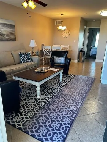 a dining room with a table and chairs
