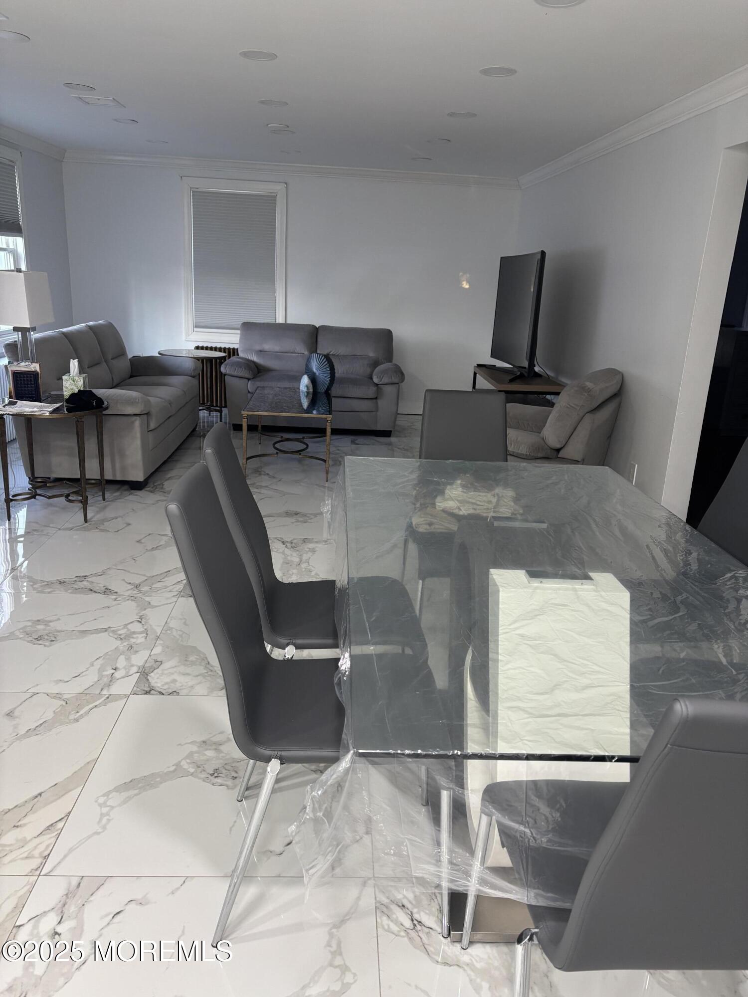 295 Roosevelt Avenue Oakhurst, NJ 07755 - Photo 3 of 16 a living room with furniture and a rug