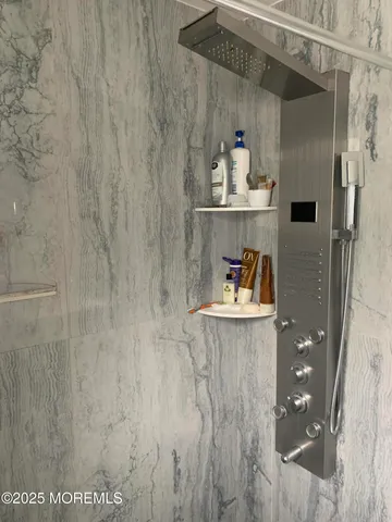 a bedroom with a bed and a lamp