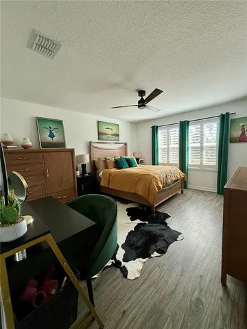 a bedroom with furniture and a window