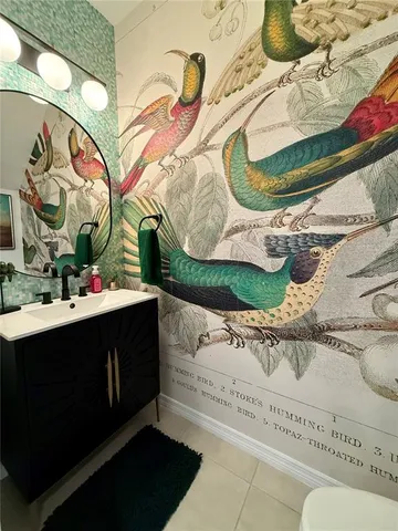 a bathroom with a sink and mirror