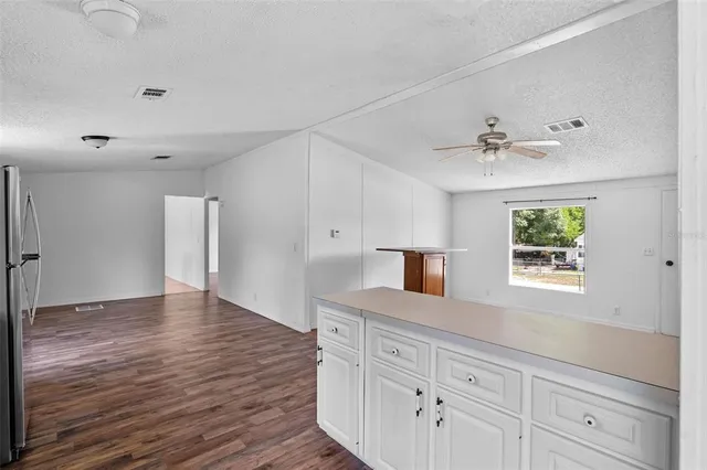 a bathroom with a sink and a large mirror