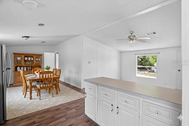 a view of dining room and wooden floor
