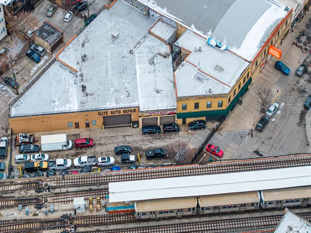 an aerial view of a building with street